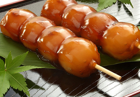 Mitarashi Dango: mochi skewers with sweet and savory sauce